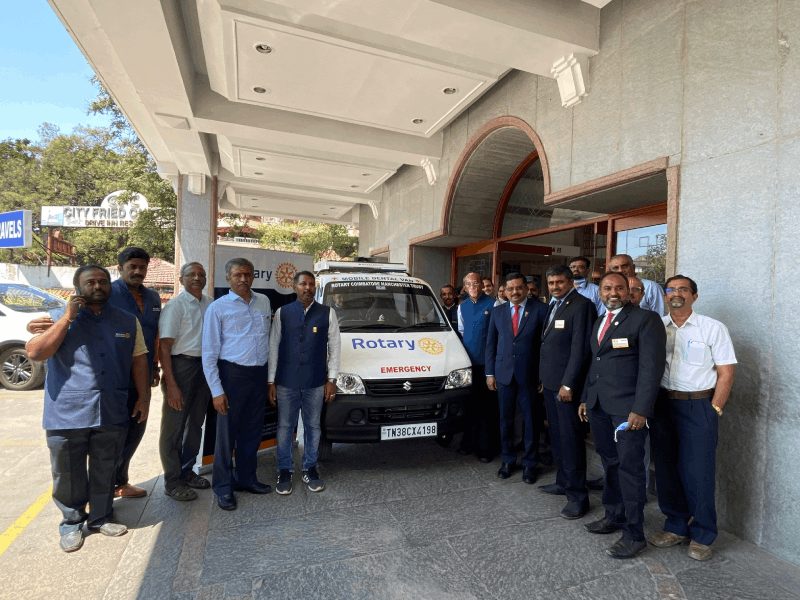 Rotary Coimbatore Manchester members with the club emergency dental van